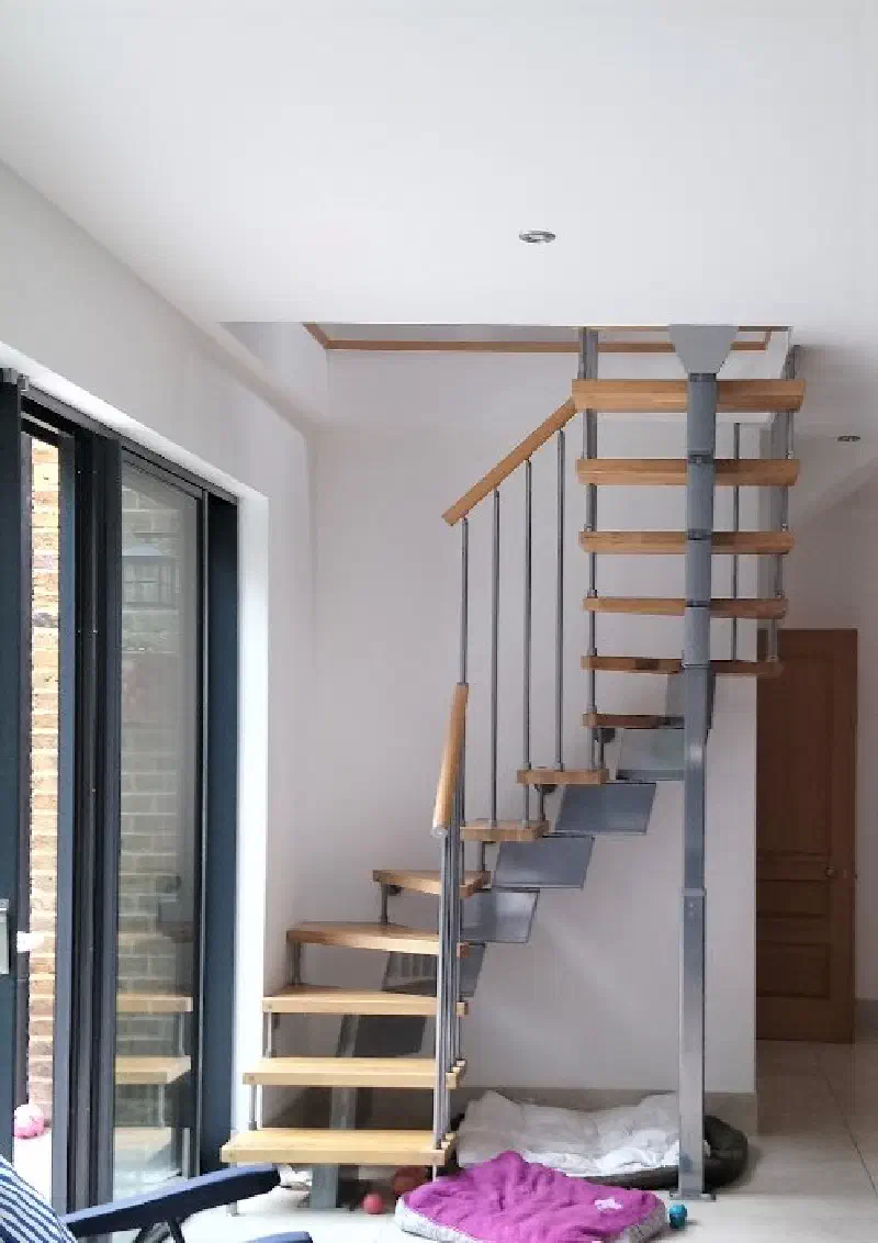 The spiral staircase leading up to the loft family room