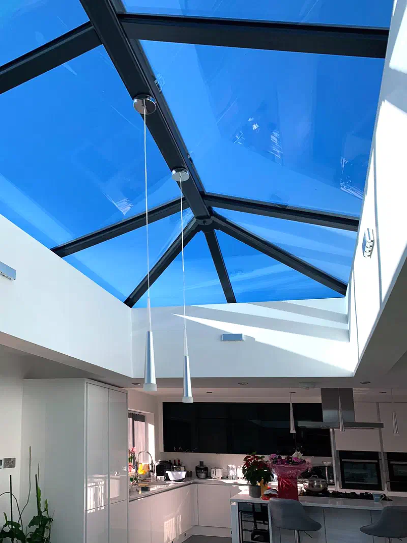 A glazed roof lantern over the new open-plan room, seen from below against the sky